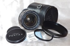 Objectif M42 28mm f3,5 SUPER TAKUMAR en set d'origine + filtre, pare-soleil TBE