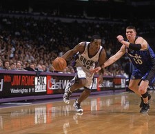 Guard Michael Redd Milwaukee Bucks drives past forward Mike Mille- 2002 Photo