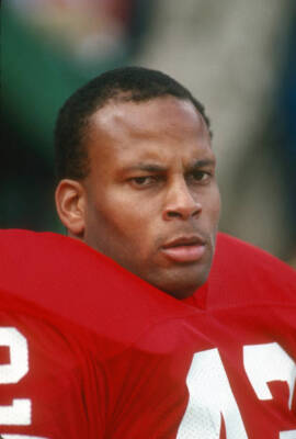 Ronnie Lott San Francisco 49ers looks on from the bench duri Football 1988 Photo
