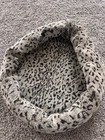 Leopard Print Cat Bed With Assorted Cat Toys — photo 1