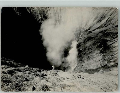 39884880 - Researcher at the Edge of a Smoking Crater Photographer Satake Volcano