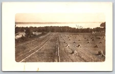 RPPC Farm Field with Lake View Location unknown real photo post card AZO 1904-18