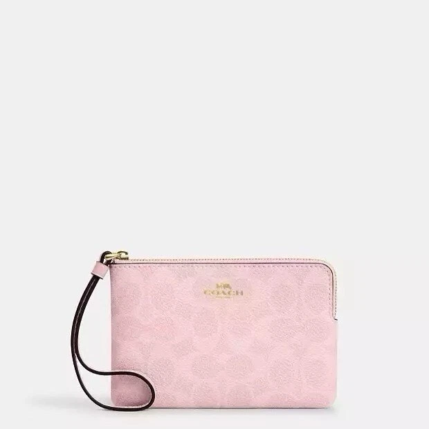 Bracciale Coach con zip angolare nuovo con etichette in tela firmato CAQ75 IM rosa cipria