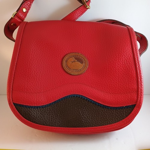 Dooney and Bourke all weather leather purse Has Some Condition Issues See Pics