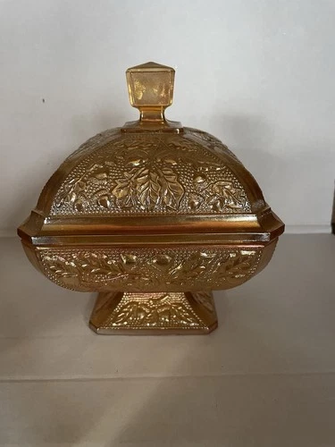 Vintage amber carnival glass covered candy dish in the "Acorn" pattern.