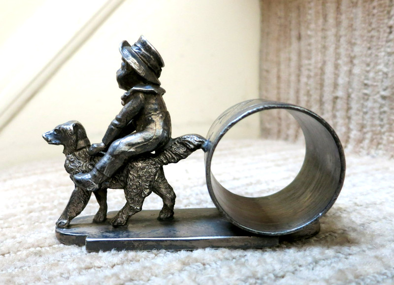 ANTIQUE FIGURAL NAPKIN RING - KATE GREENAWAY BOY RIDING DOG - 829