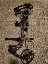 Mathews TX5 bow black libs with black riser used, but in perfect condition 