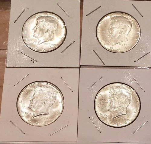 Four 1964 Kennedy half dollars