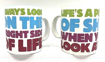 A pair of MONTY PYTHON ''LOOK ON THE BRIGHT SIDE'' coffee mugs -- unused, pristine