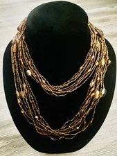 Amber Glass And Seed Bead 10-Row Beaded Necklace 21” long slip over the head. 