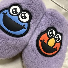 One pair Sesame Street sherpa lined slippers W/O tags Size: S/M 6.5 under