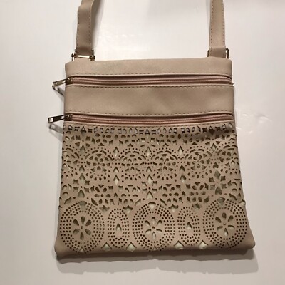 Cream Beige colored shoulder bag purse with laser cutouts zippers