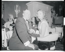 Comedian George Jessel starlet Joan Tyler are shown enjoying them- 1956 Photo