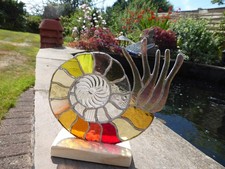Stained Glass  Nautilus On A Wooden Plinth With A Central Circular Bevel