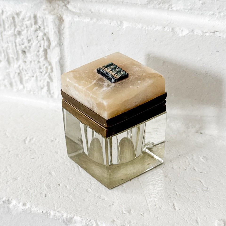 Art Deco beveled glass inkwell with an onyx stone lid and brass fittings — this is the desk accessory that makes grown adults gasp a little.