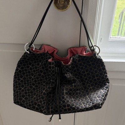 Kate Spade Black shoulder bag with stitched design.  Pink interior.