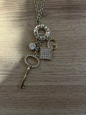 Guess  Gold Tone  Logo Lock-Key Pave Charm Necklace