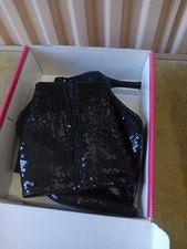 This is a pair of black sequined high-heel ankle boots.