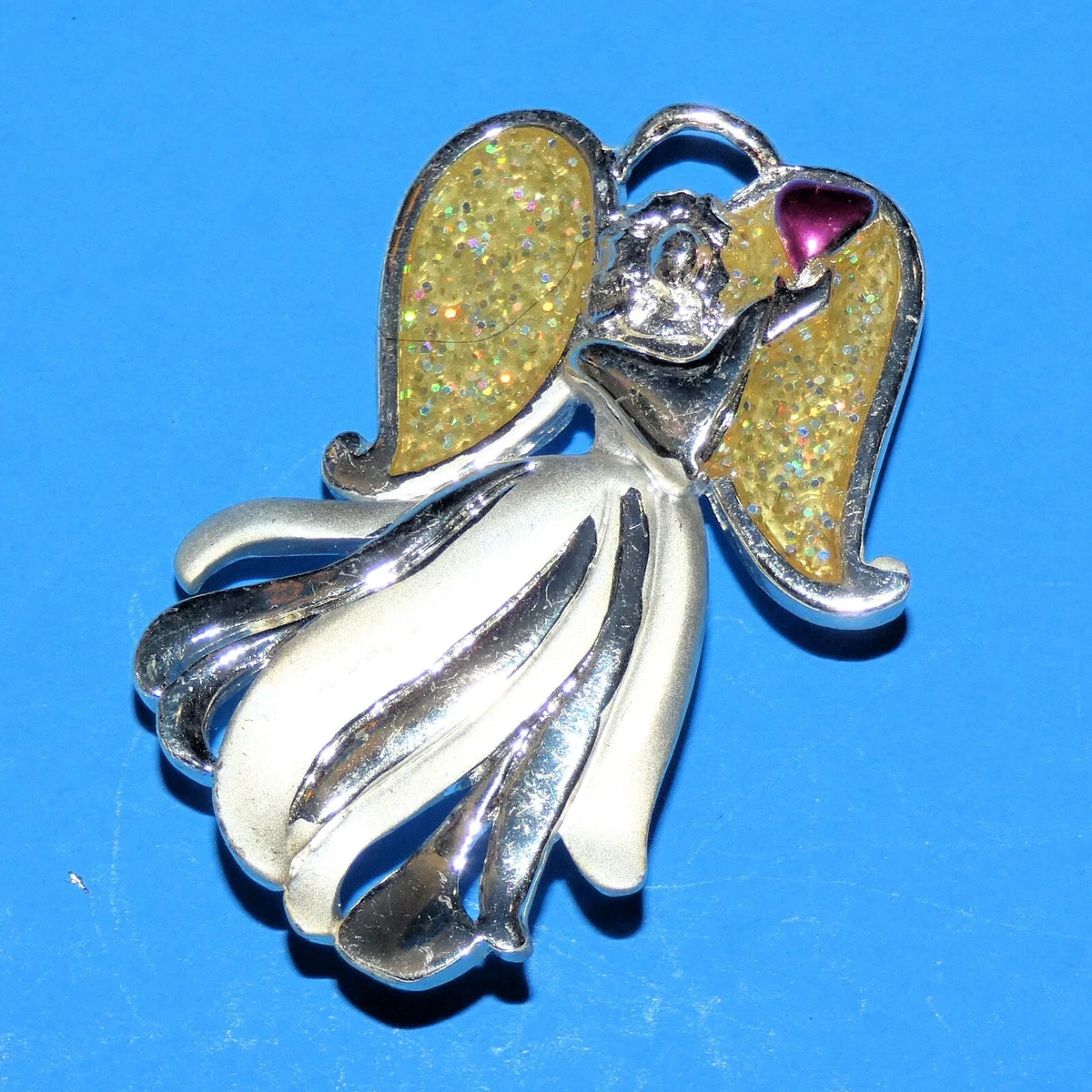 Aai brooch best sale