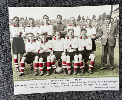 Players of Liverpool pose for a photo as they celebrate the teams