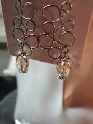 Aretes de mujer de moda en acero inoxidable ,y cristal hecho en alambrismo