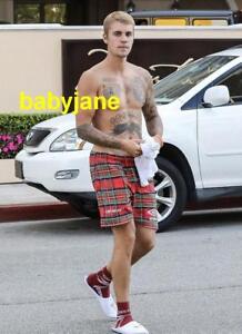 115 JUSTIN BIEBER BARECHESTED WEARING PLAID SHORTS CROSSING STREET