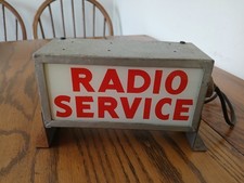 Vintage lighted radio service sign