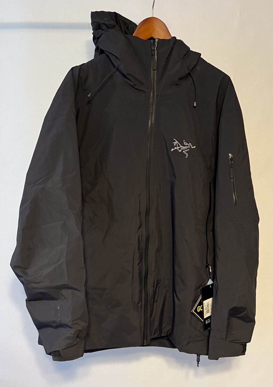 Nuovissima giacca Arc'Teryx uomo sciabola isolata extra large nera nuova con etichetta