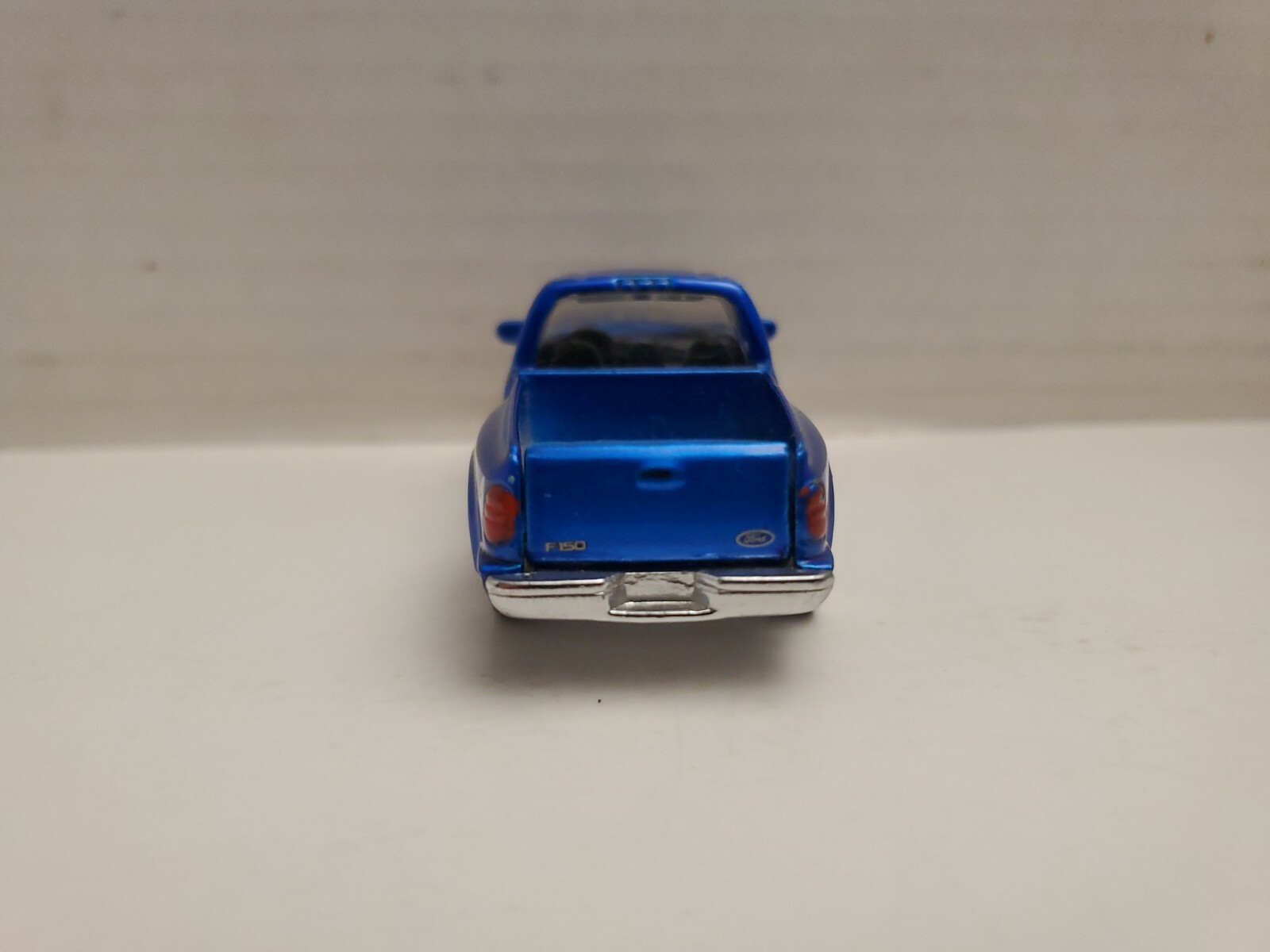 RACING CHAMPIONS  1997 FORD F-150, MET BLUE & BLACK W/ BLACK INTERIOR