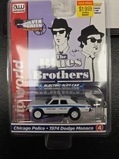 AUTO WORLD 2021 BLUES BROTHERS 1974 DODGE MONOCO WHITE LIGHTNING CHASE SLOT CAR