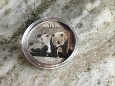 2010 SILVER CHINA 10 YUAN 1 OZ PANDA COIN IN CAPSULE