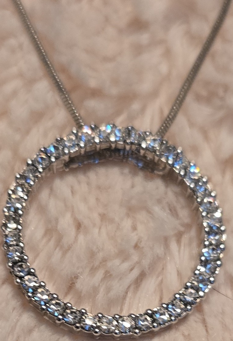 silver tone round pendant necklace with clear stones snake chain lobster closure