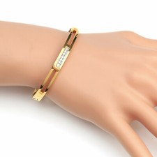 Stylish Gold Tone Bangle Bracelet with Sparkling Embedded Crystals