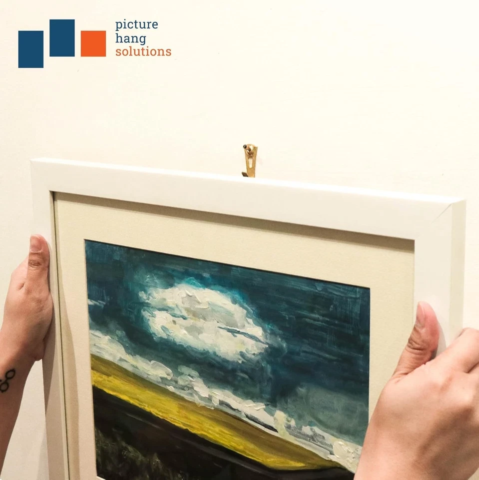 Paquete de 100 ganchos para colgar cuadros de latón Foto 4 de 4