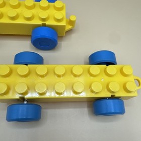 2 Vintage LEGO Duplo Yellow Vehicle Base 2x8 Chassis Blue Wheels Trailer Hook