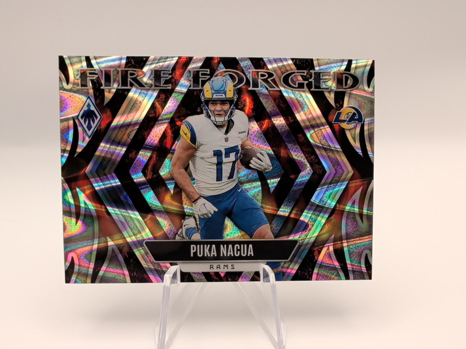 2023 Panini Phoenix - Fire Forged Puka Nacua #FF-8 Silver Seismic (RC)