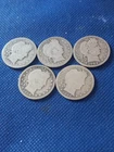 five old silver barber quarters