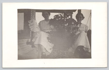 Postcard RPPC Young Women Porch Swing White Dresses Smiling Outdoor Potted Plant