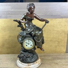 beautiful French young lady mantle clock , musical themed , interesting clock.