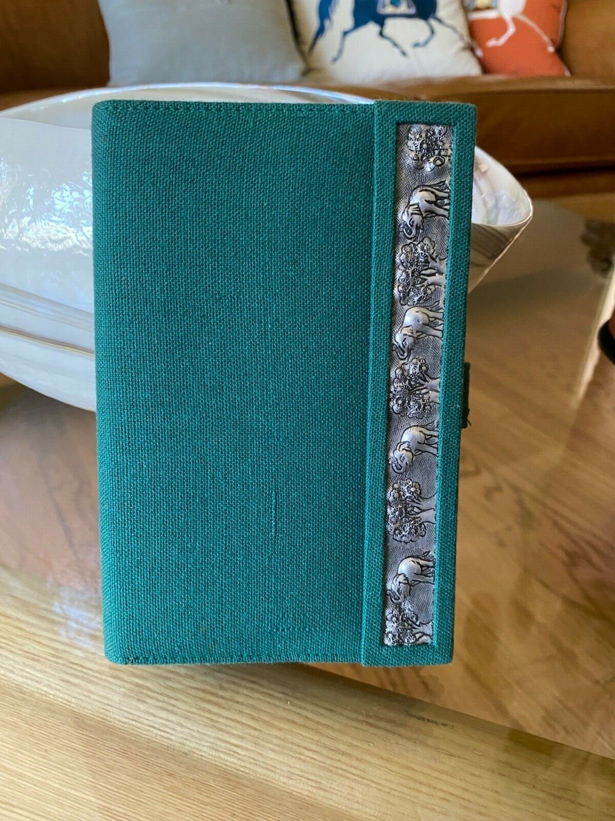 Green passport holder with embroidered metal elephants and tree trim-image