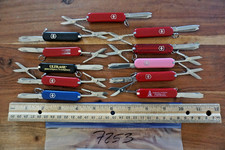 7253   11 assorted Victorinox (Swiss Army) classic SD pocket knives