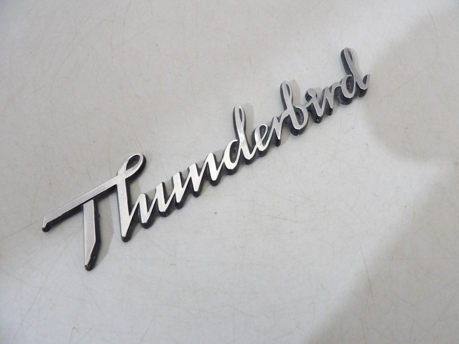 1977 1978 1979 FORD THUNDERBIRD OEM HEADLAMP DOOR EMBLEM ORNAMENT SCRIPT