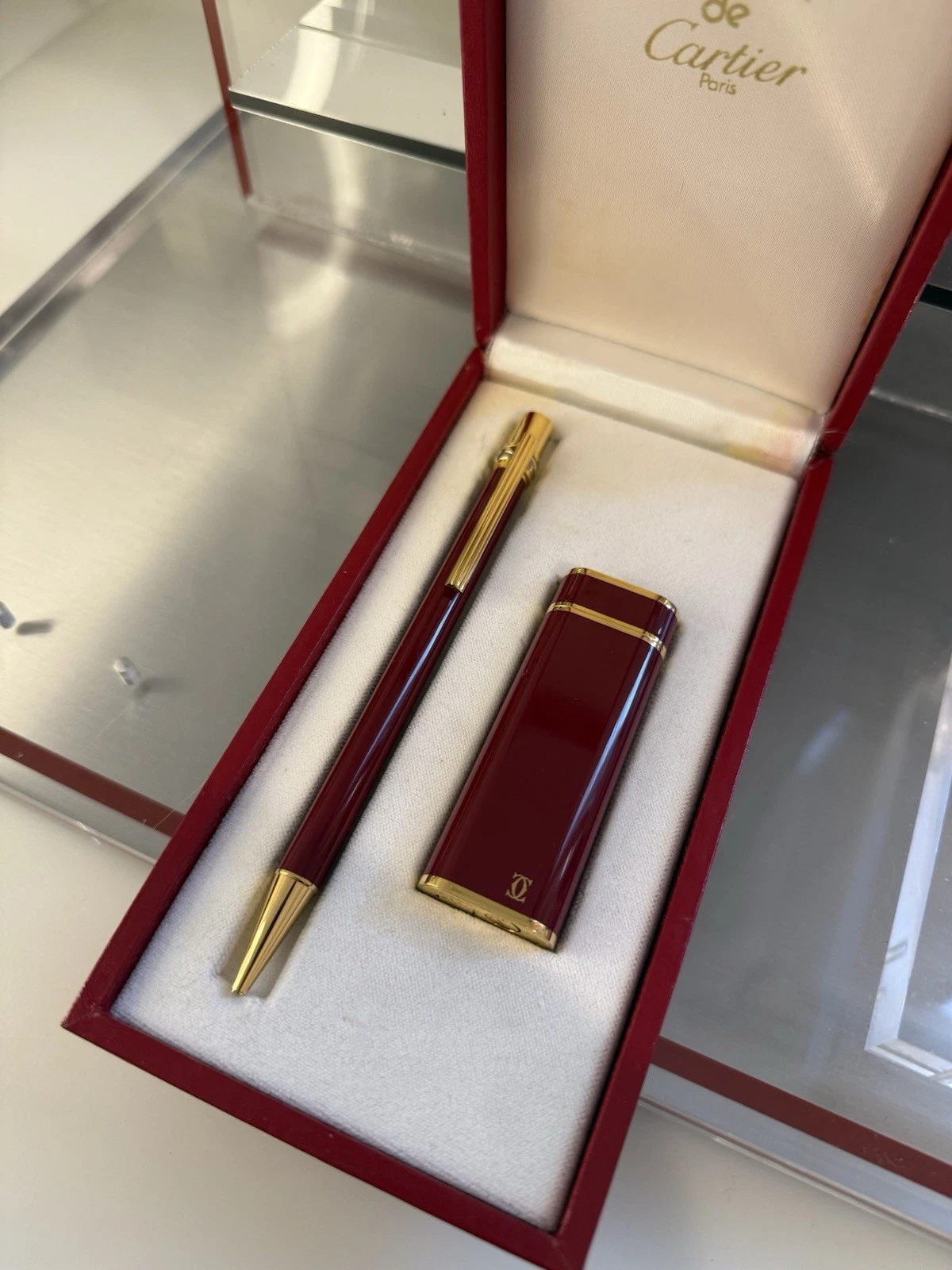 Cartier — Cartier Burgundy Lacquer Gold-Plated Lighter & Ballpoint Pen Set