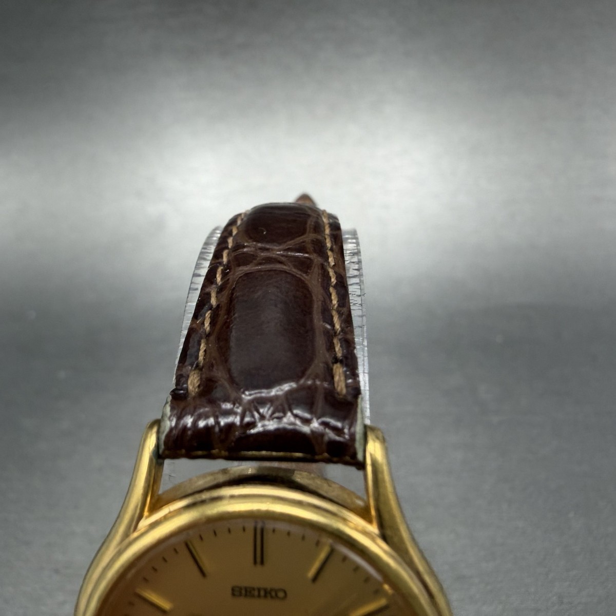 Seiko Gold Tone 26mm Date Womens Watch Brown Leather V782-8E50 w New Battery Seiko Watch Women 25mm Gold Dial Gold Tone Date Round 7N82  main image 4