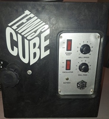 ''TENNIS CUBE'' BY SPORTS TUTOR. BATTERY POWERED, 70 BALL CAPACITY, SEE PICS, USED