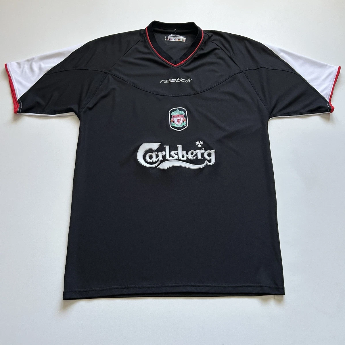 Preços baixos em Reebok Liverpool Preto Clube Internacional de
