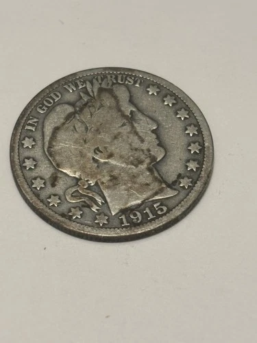 1915 BARBER HALF DOLLAR. LOW MINTAGE 138,000 ONLY. VG CONDITION.