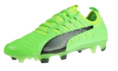 green and white football boots