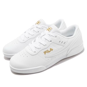 white and gold fila trainers