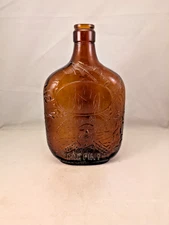 Paul Jones Four Roses Whiskey Bottle -Embossed George Washington & 3 boats amber